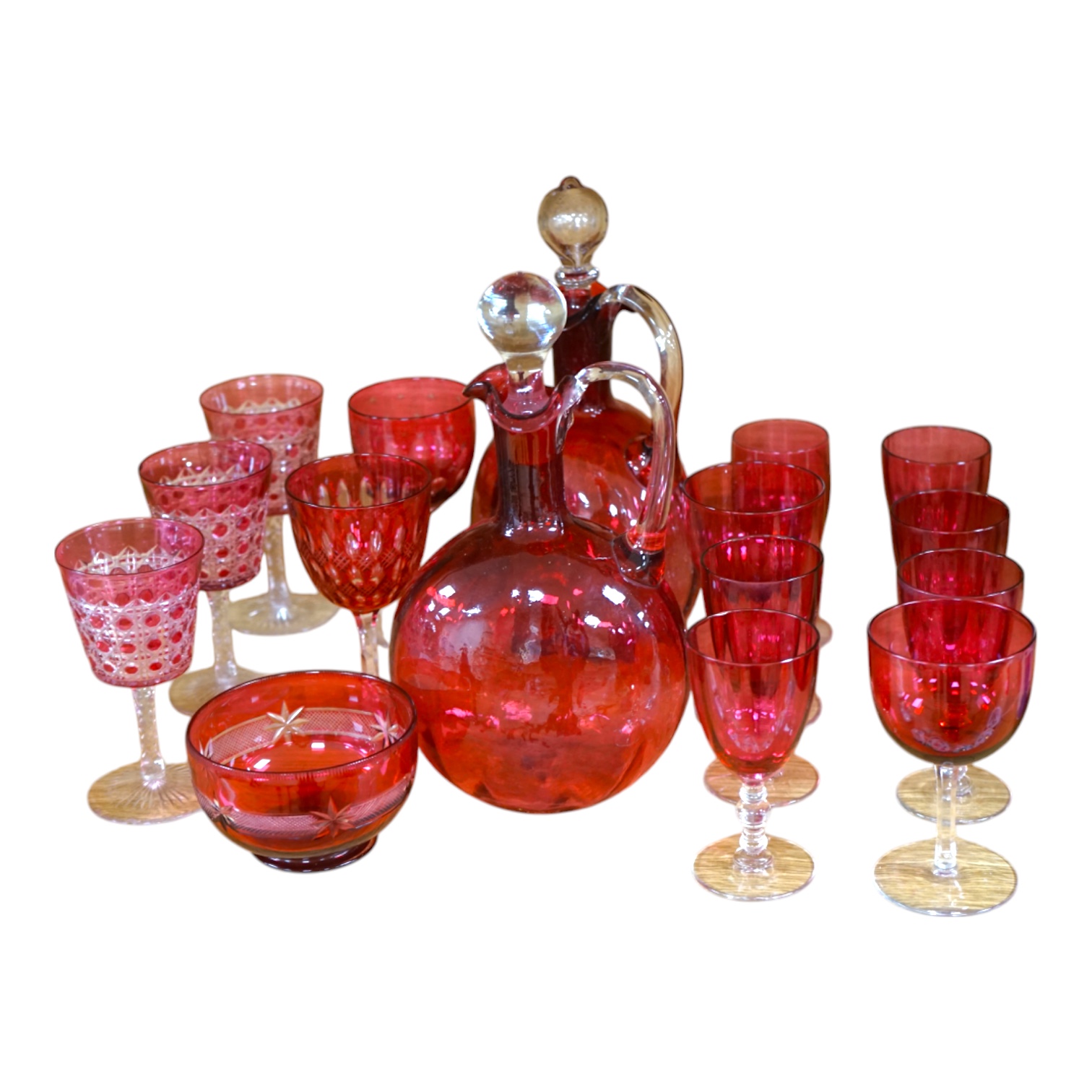 Two cranberry glass liqueur decanters and a collection of various glasses and a bowl, decanters 25cm high. Condition - good